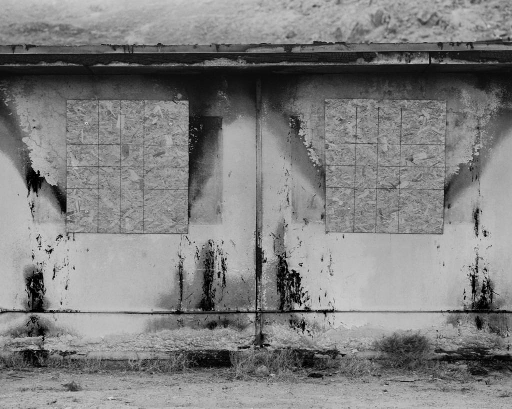 Black and white image of a weathered wall