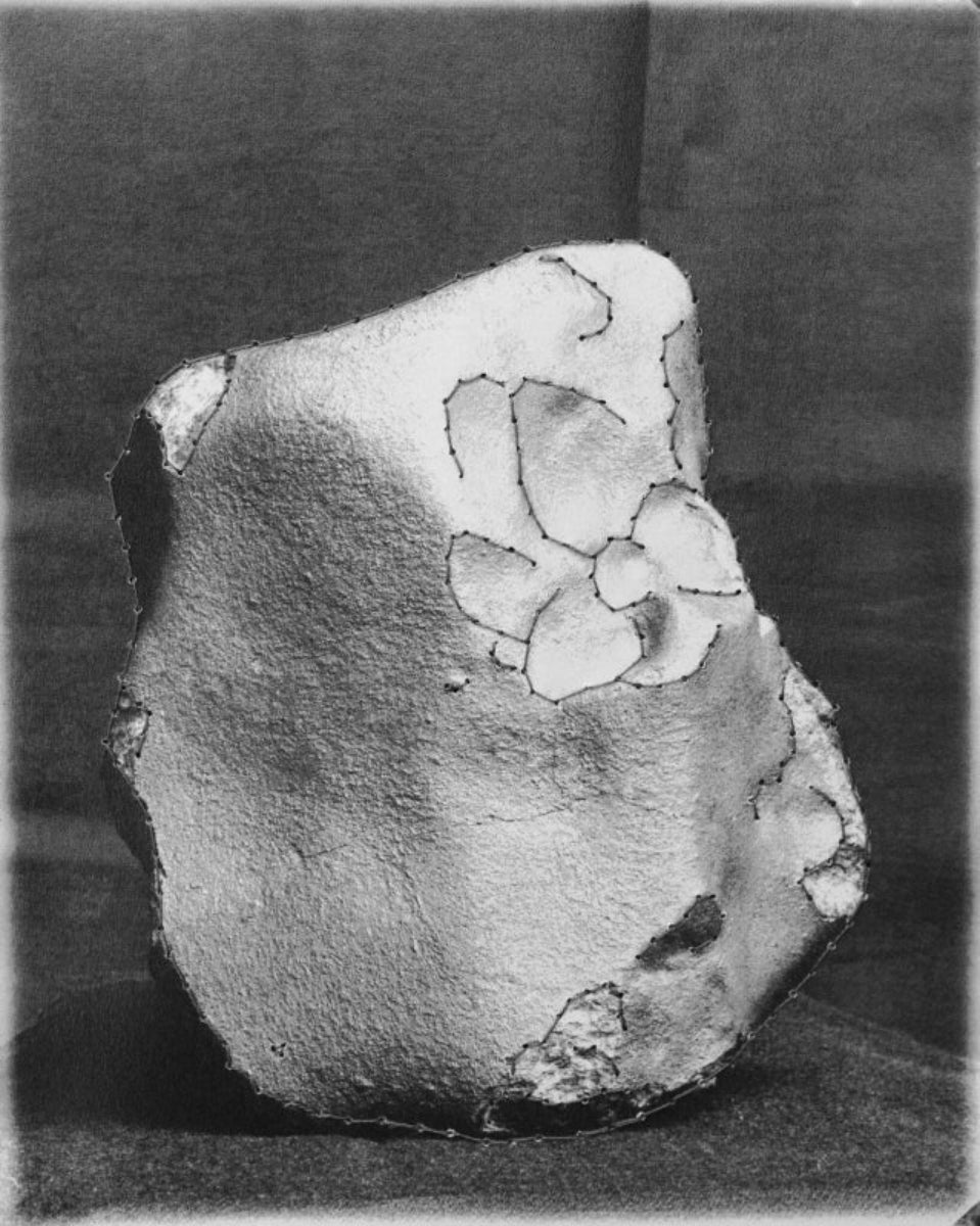 black and white rock with thread