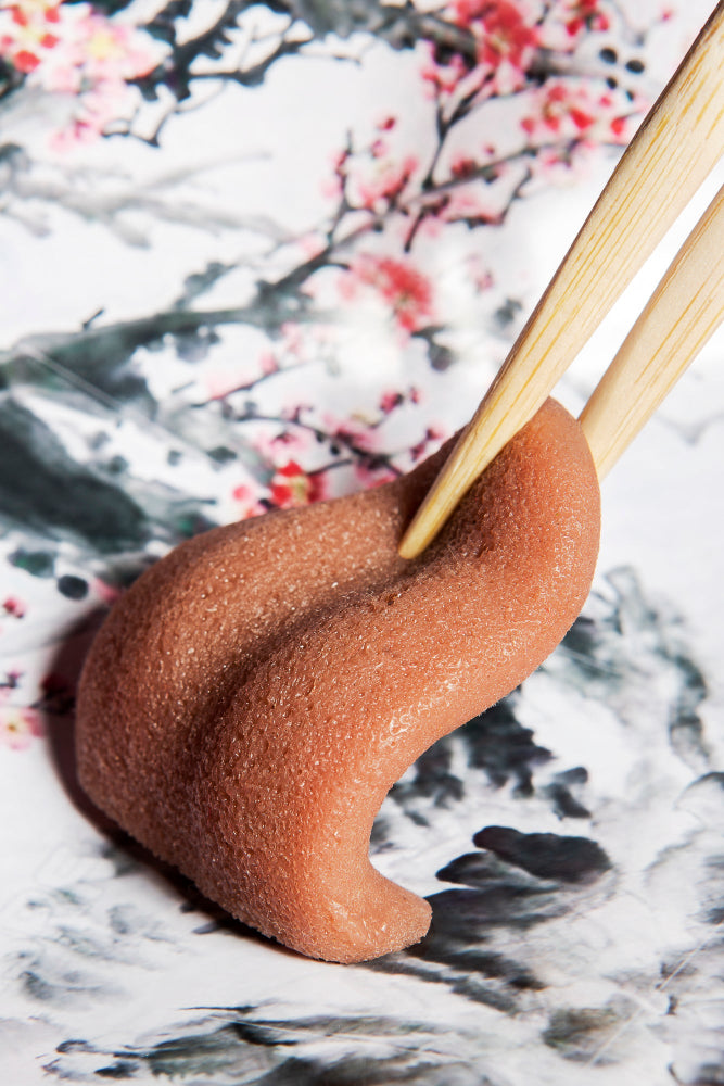 fake tongue with chopsticks