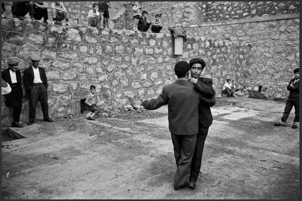 black and white couple of men dancing on square