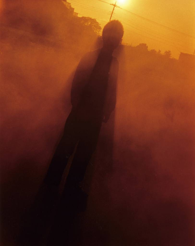 silhoute with a sunset and foggy background