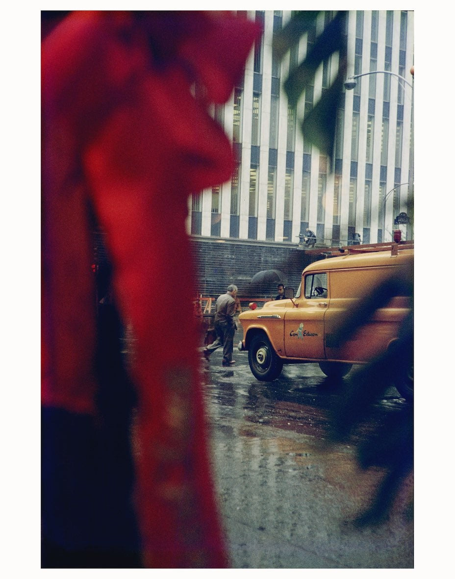 saul leiter street yellow cab red coat
