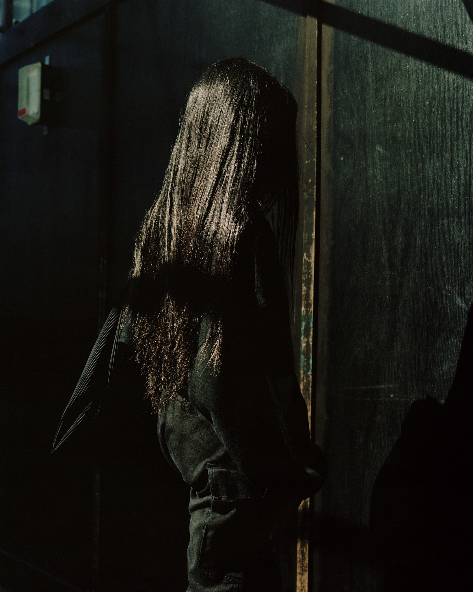 London woman black hair from behind