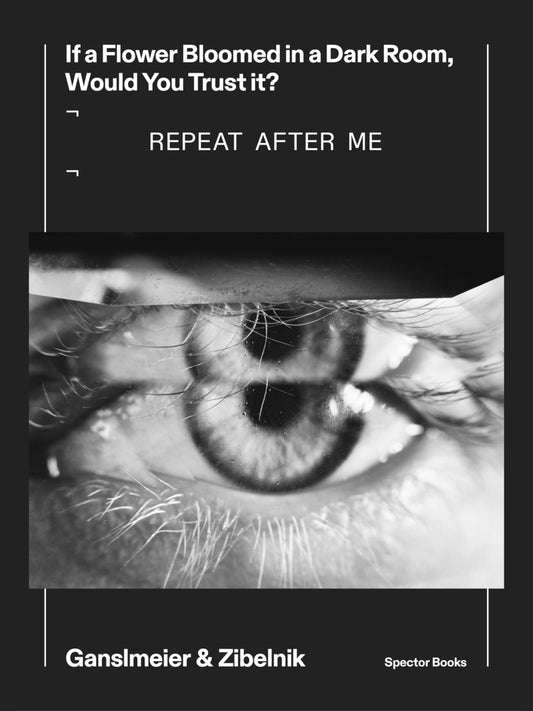 black cover with black and white photo of a double eye