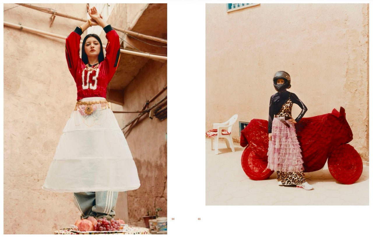 Spread with two standing colour photos with on the left a woman dressed in sporty clothes, holding her arms up. On the right a woman in a skirt, standing in front of a motorbike covered in red lace.