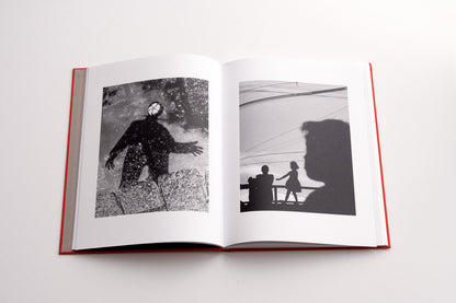 book spread with two black and white images of street views