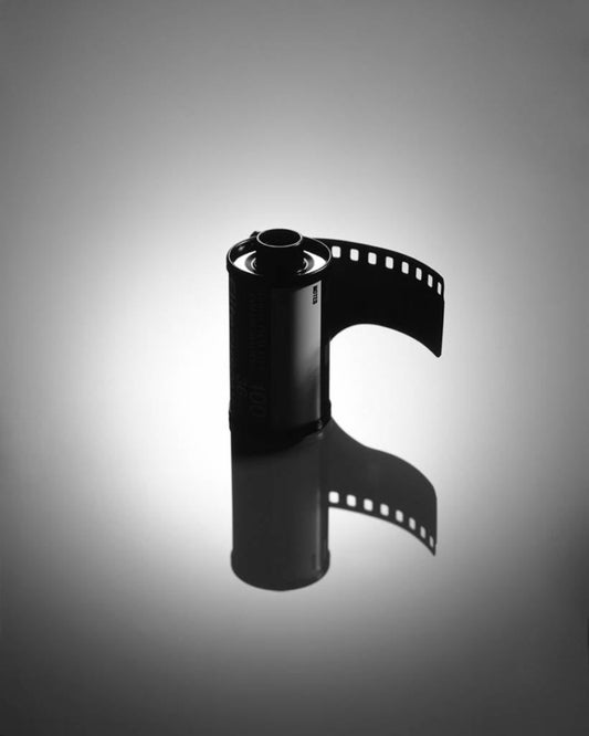 black and white filmroll on mirroring surface