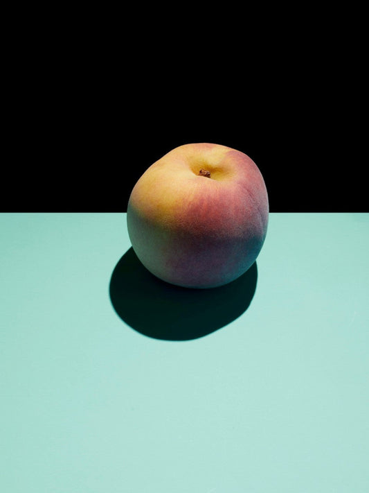 Peach on blue and black background