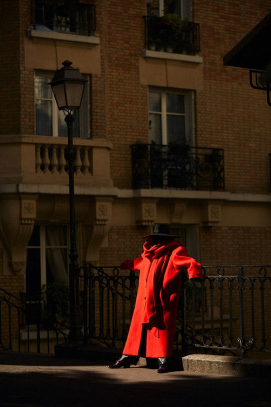 red coat on bridge