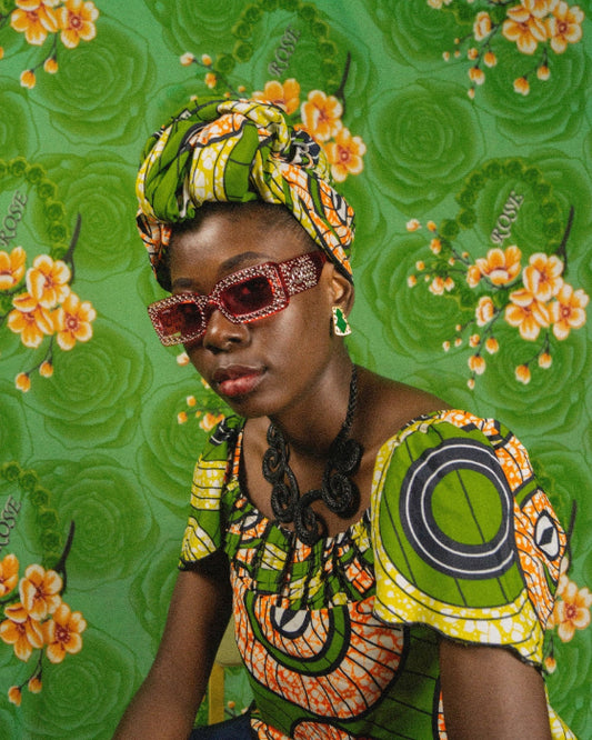 Women dressed in green in fron of green floral background