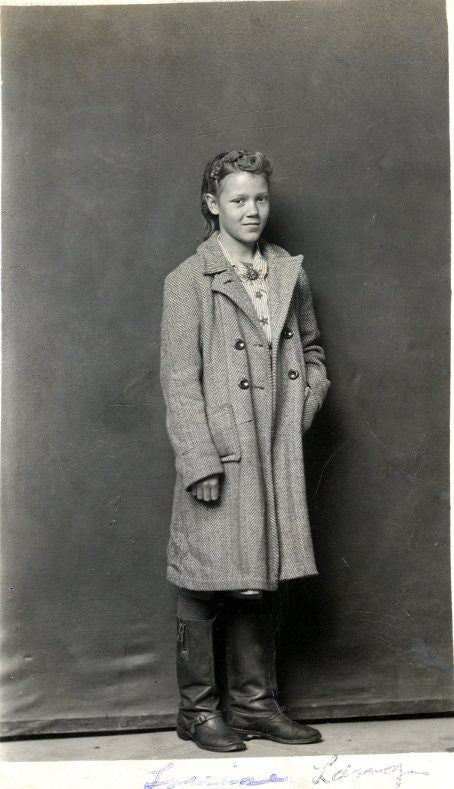 black and white photo of a young woman facing towards the camera