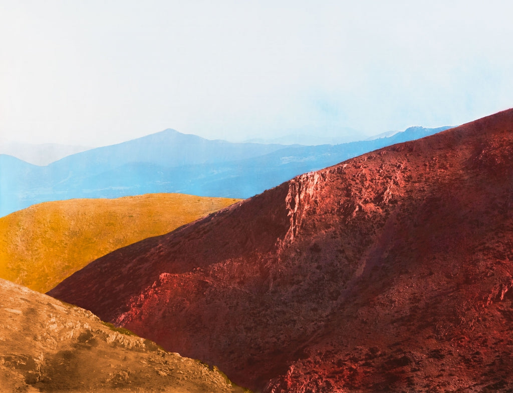 landscape mountains in blue, red and orange