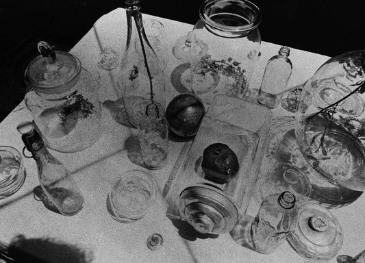 Black and white image of glasswear on a table