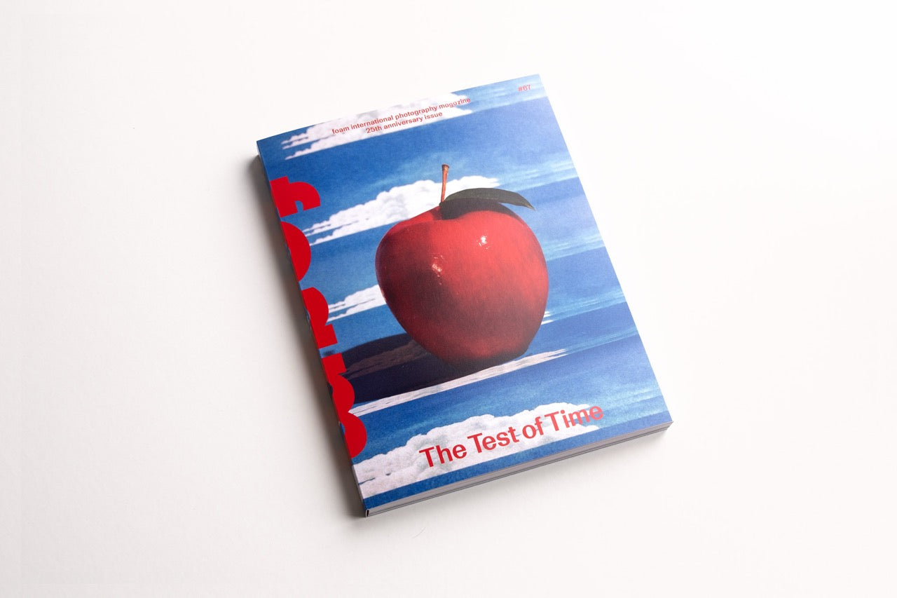 cover foam magazine the test of time with a blue background and a red apple