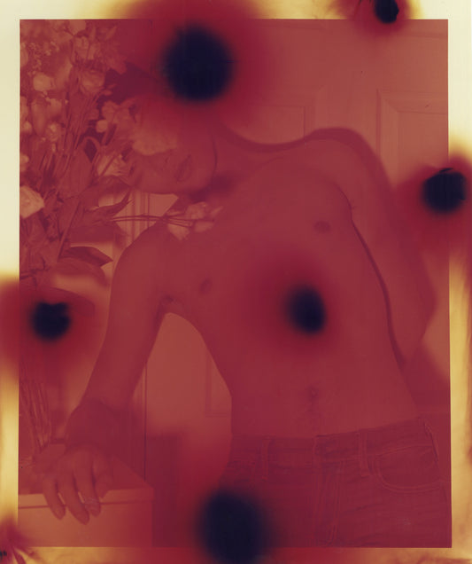Red and yellow image of a figure, layered with black dots