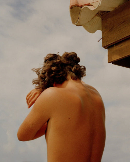 portrait of naked torso boy from back