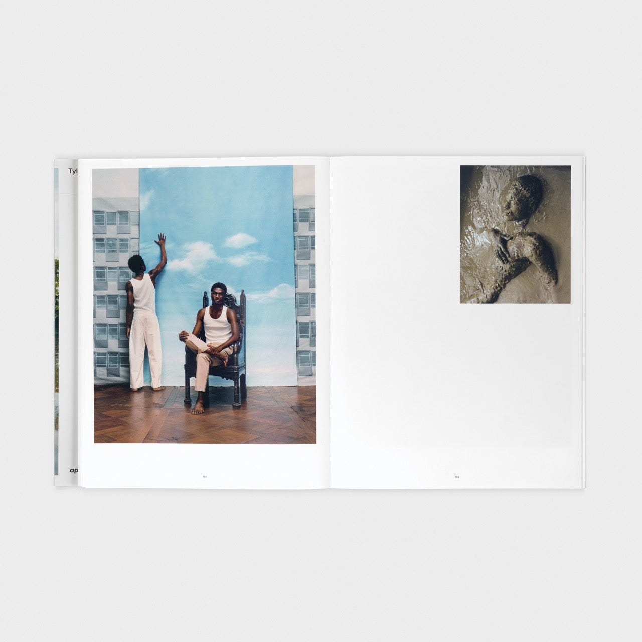 spread of the book with on the left page two men in front of a large picture of a blue cloud and right the torso of someone in muddy water